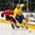 GRAND FORKS, NORTH DAKOTA - APRIL 18: Switzerland's Fabian Berni #9 and Sweden's Jakob Cederholm #3 chase down a loose puck during preliminary round action at the 2016 IIHF Ice Hockey U18 World Championship. (Photo by Minas Panagiotakis/HHOF-IIHF Images)


